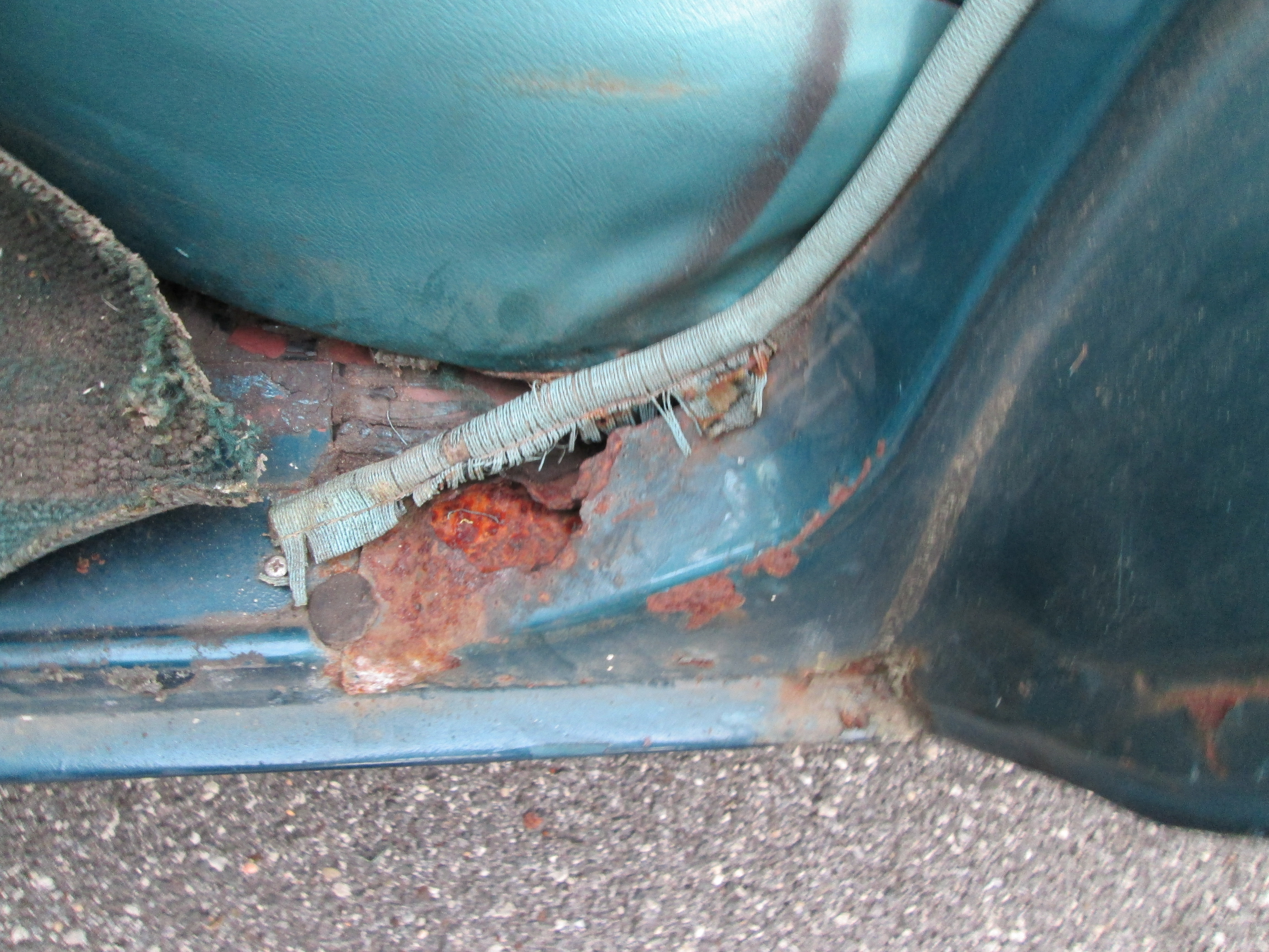 A little bit of rust damage in the bottom of the door well on the rear left passenger door, little bit of metal patching ought to fix that